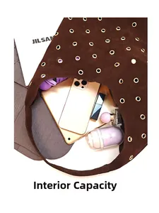 Top view of large brown suede tote bag showing spacious interior with daily essentials