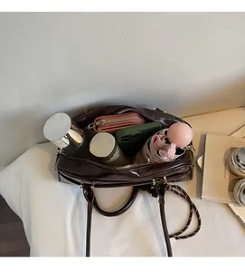 Interior view of the dark brown bowling bag showing large capacity for daily essentials
