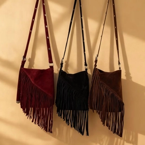 Bohemian suede crossbody bags with long fringe tassels in burgundy, black, and brown