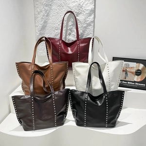 Set of minimalist large capacity tote bags with rivet accents in five different colors