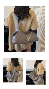 Détail du grand sac cabas en cuir souple gris foncé avec poches latérales et large bandoulière