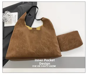 Detail showing brown faux suede tote bag with yellow interior and small inner pouch