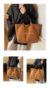 Brown suede tote bag with white TOTE BAG lettering shown on a casual female model outfit