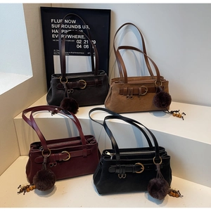 Detailed view of vintage shoulder bags in dark coffee, burgundy, khaki, and black options