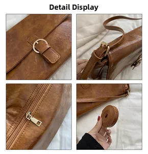 Detail view of brown faux leather crossbody bag featuring metal buckle and adjustable strap