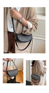 Detail showing black half-moon rivet bag with dual straps and silver metal hardware studs
