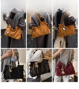 Detailed views of high-capacity tote bags in brown, black, and burgundy with charm details