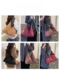 Detail of suede tote bag with metal rivet accents available in five seasonal colors