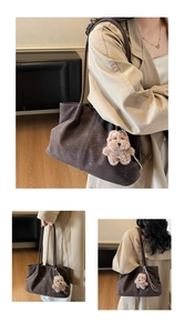 Detail view of coffee tote bag with soft suede texture and plush bear pendant