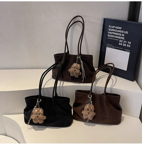 Three retro suede tote bags in black, coffee, and brown colors with cute dog charms