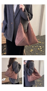 Detail view of large dark brown suede tote bag featuring metallic silver rivet accents