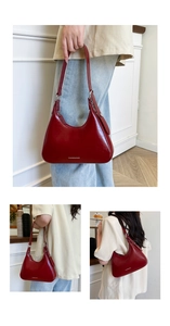 Detail view of burgundy patent leather hobo bag with a shiny finish and adjustable strap