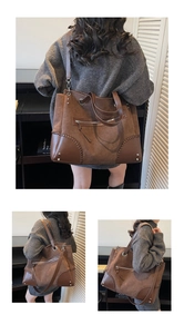 Dettaglio della borsa tote vintage in pelle scamosciata marrone con cuciture spesse