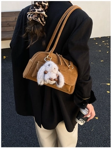 Brown suede underarm bag with a cute white bunny plush pendant for autumn daily use
