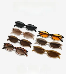 Flat lay view showcasing seven stylish oval frame sunglasses in various trendy colors
