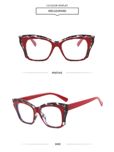 Detail view of red leopard cat-eye glasses frame with stylish two-tone color blocking design