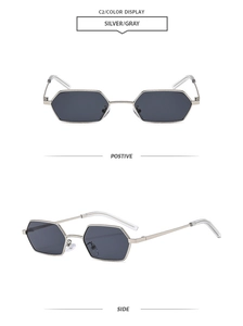 Detailansicht der silbernen sechseckigen Metall-Sonnenbrille mit grauen Gläsern und Bügeln