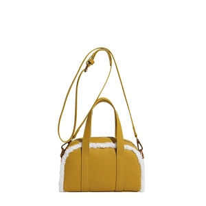 Yellow faux suede bowling bag with white plush fleece trim and adjustable shoulder strap