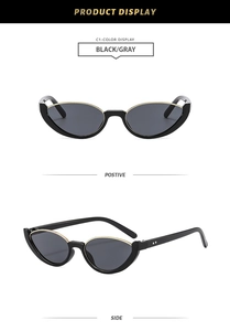 Détail de lunettes de soleil œil de chat rétro avec monture noire et détails dorés