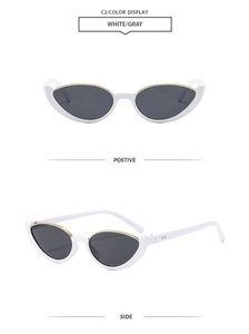 Détail de lunettes de soleil œil de chat blanches avec verres gris et accents dorés