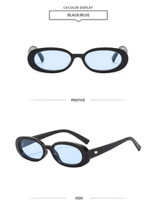Detail view of oval black frame sunglasses with light blue lenses and silver accents