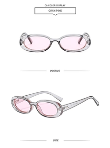 Detail view of oval gray frame sunglasses with pink lenses from front and side angles