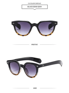 Fashionable oval frame sunglasses featuring retro metal rivets and purple gradient lenses