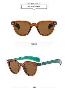 Detail view of oval retro brown sunglasses with contrasting green inner temple and silver rivets