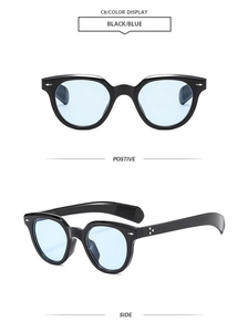 Detail view of oval retro sunglasses with black frames, blue lenses and arrow rivets