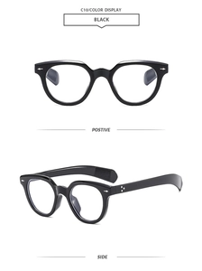 Close-up of black retro oval frame sunglasses with silver arrow studs and side view details