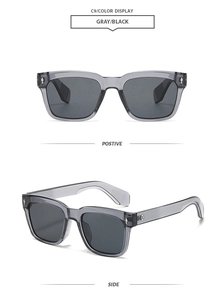 Detail view of square translucent gray sunglasses with metal diamond rivets and dark lenses