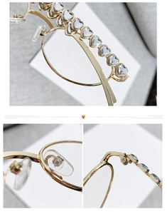 Detailed macro view of gold metal frames with heart-shaped rhinestones and silicone nose pads