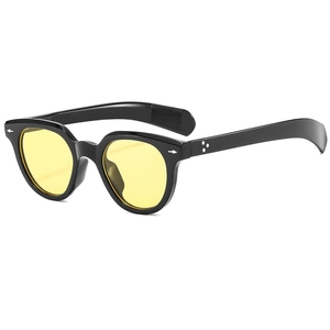 Retro oval black frame sunglasses with yellow lenses and silver rivets in 45-degree view