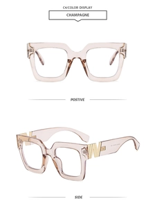Detail of champagne square eyeglass frames with gold W-shaped metal hinges and inner temple codes