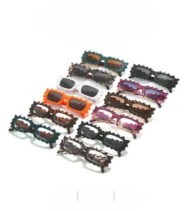 Detailed view of wavy rim sunglasses in multiple colors showing high-gloss resin frames