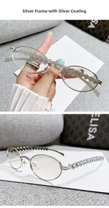 Detail of silver oval sunglasses with heart chain temples and rhinestone bridge accents