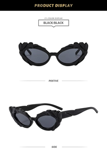Detailed front and side views of black cat-eye sunglasses with flame-like carved edges