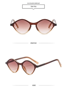 Detailed view of tea-colored geometric sunglasses with gradient lenses and clear frames