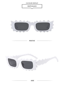 Detailed views of white irregular wavy sunglasses with black lenses from front and side angles