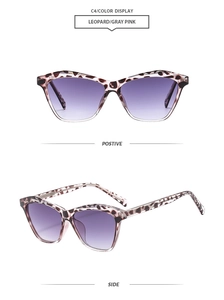 Detail view of cat eye sunglasses with leopard print frame and purple gradient lenses