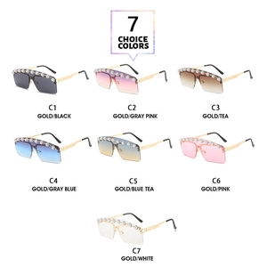 Detail of seven colored rimless sunglasses with pearl and floral decorative accents