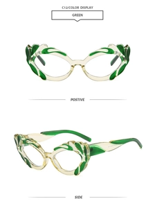 Detail view of green cat-eye sunglasses with creative flame texture on a yellow frame