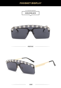 Detail of oversized rimless sunglasses with pearl trim and sparkling rhinestones
