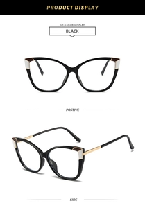 Detail of cat eye glasses frame showing black frame with gold metal edges and side arms