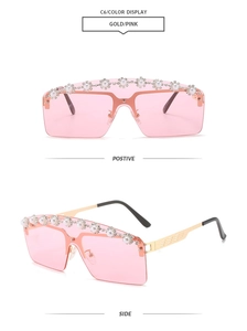 Detail of rimless pink sunglasses featuring decorative pearls and gold metal temples