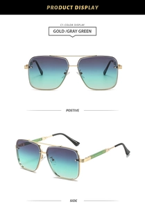Detail view of gold metal pilot sunglasses with gray-green gradient lenses and double bridge