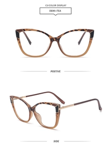 Detail of tortoiseshell cat-eye frames with golden metal accents and retro design