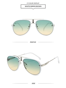Detail view of white aviator sunglasses with silver temples and green-brown gradient lenses