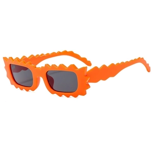 Fashionable irregular wavy orange sunglasses with dark lenses for UV protection