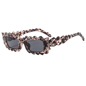 Fashionable irregular wavy square sunglasses with tortoiseshell frame and dark lenses